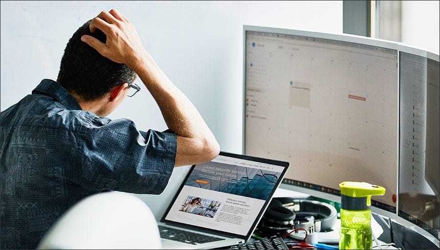 Photo of man using the internet on a laptop.